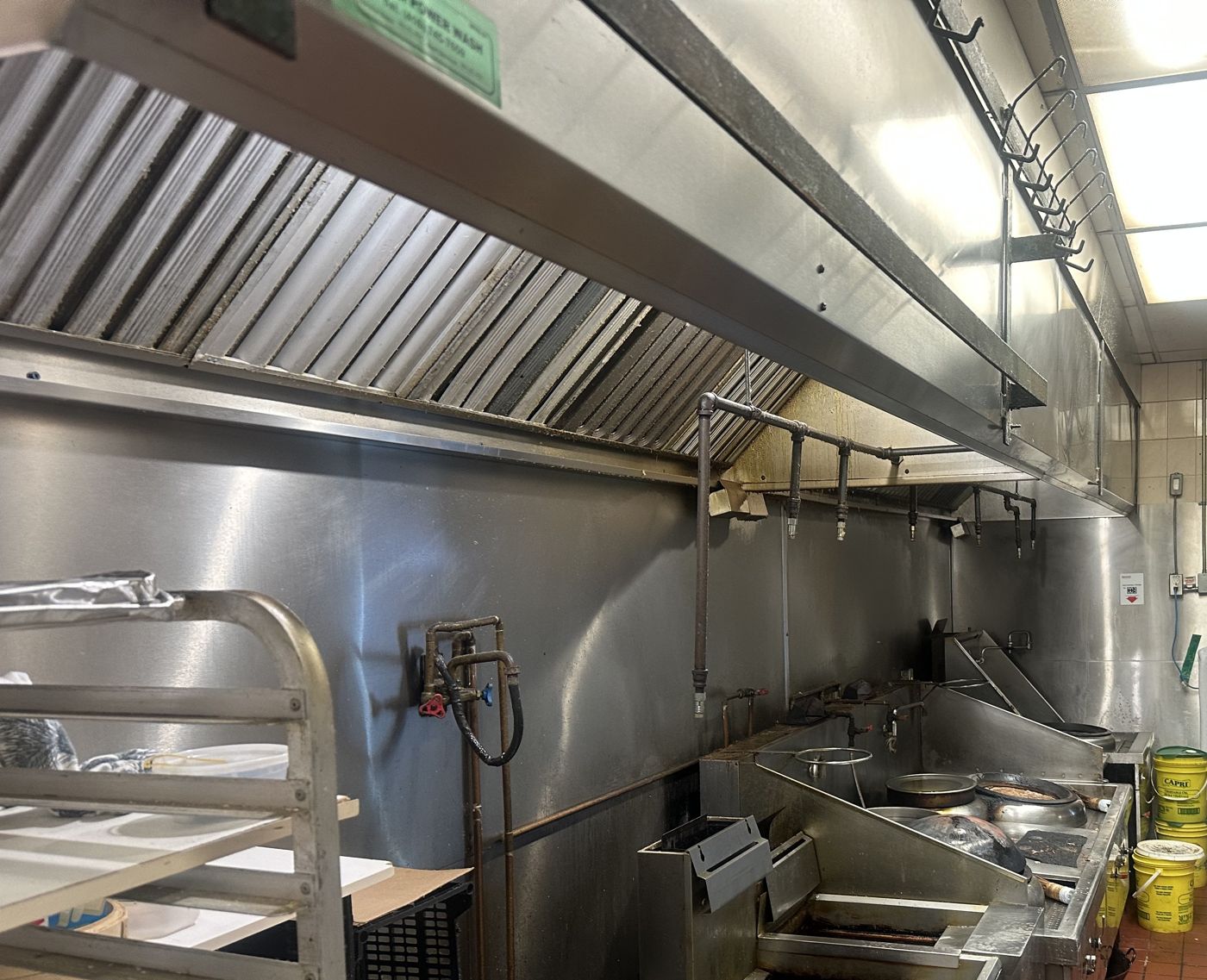 Commercial kitchen cooking line before cleaning