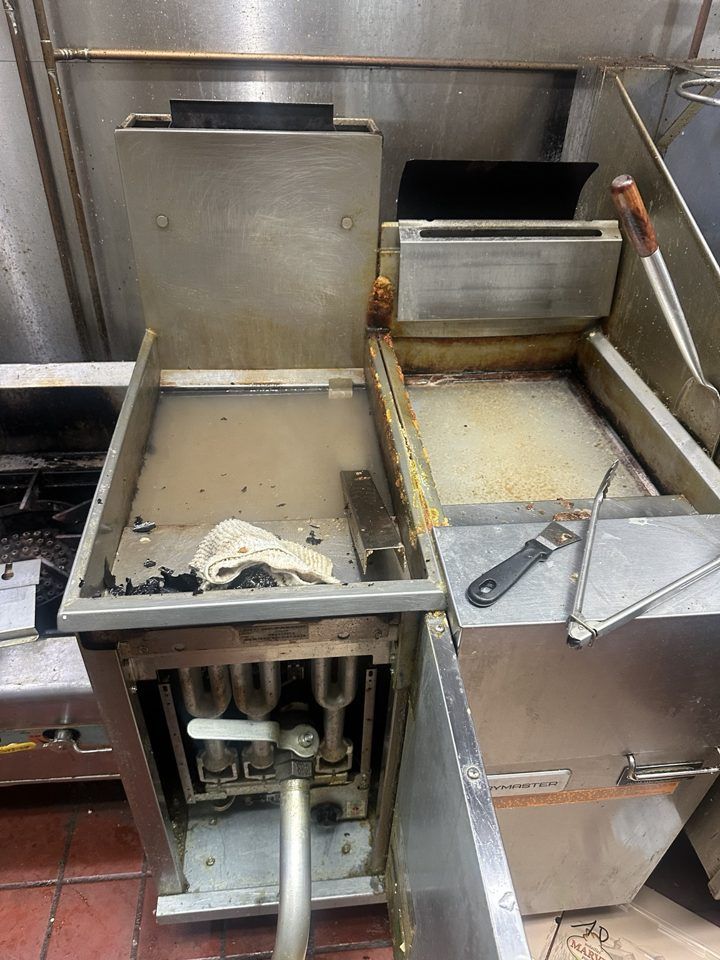 Grease buildup on a commercial fryer before cleaning